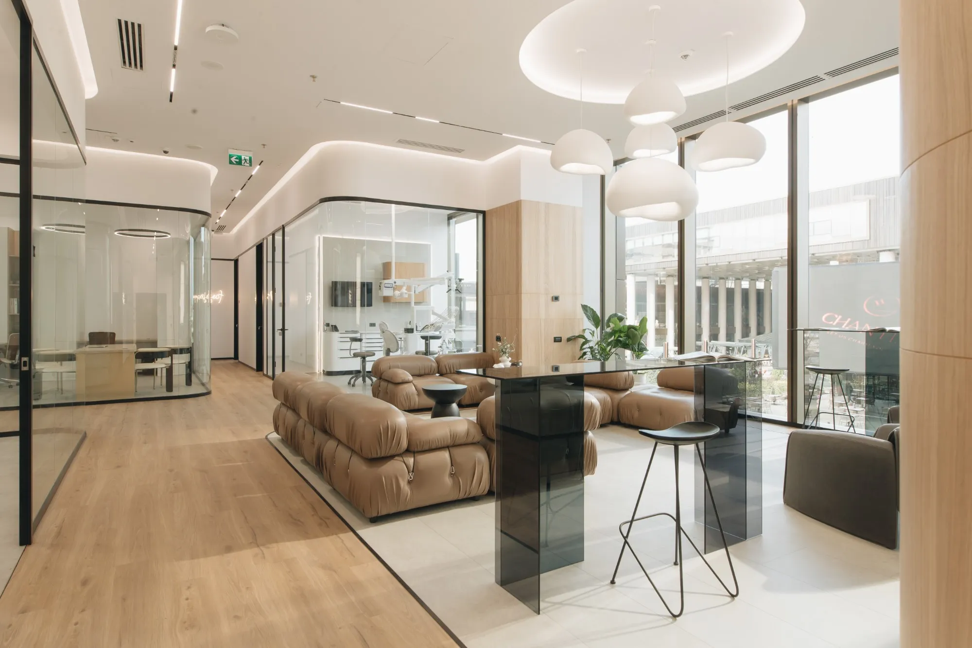 The lounge and glass-walled treatment rooms at Dentcof
