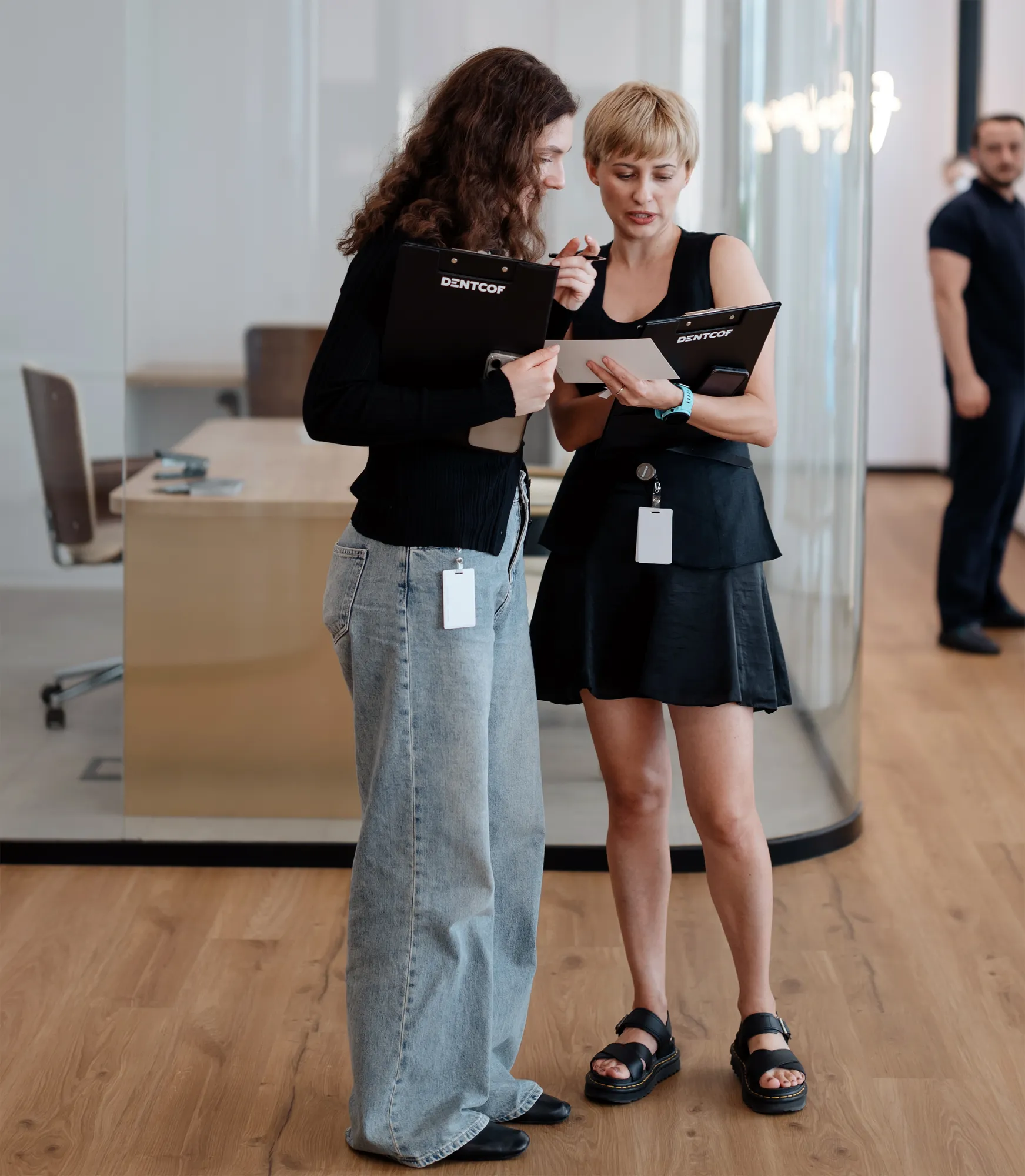 Two Dentcof team members reviewing a treatment plan together