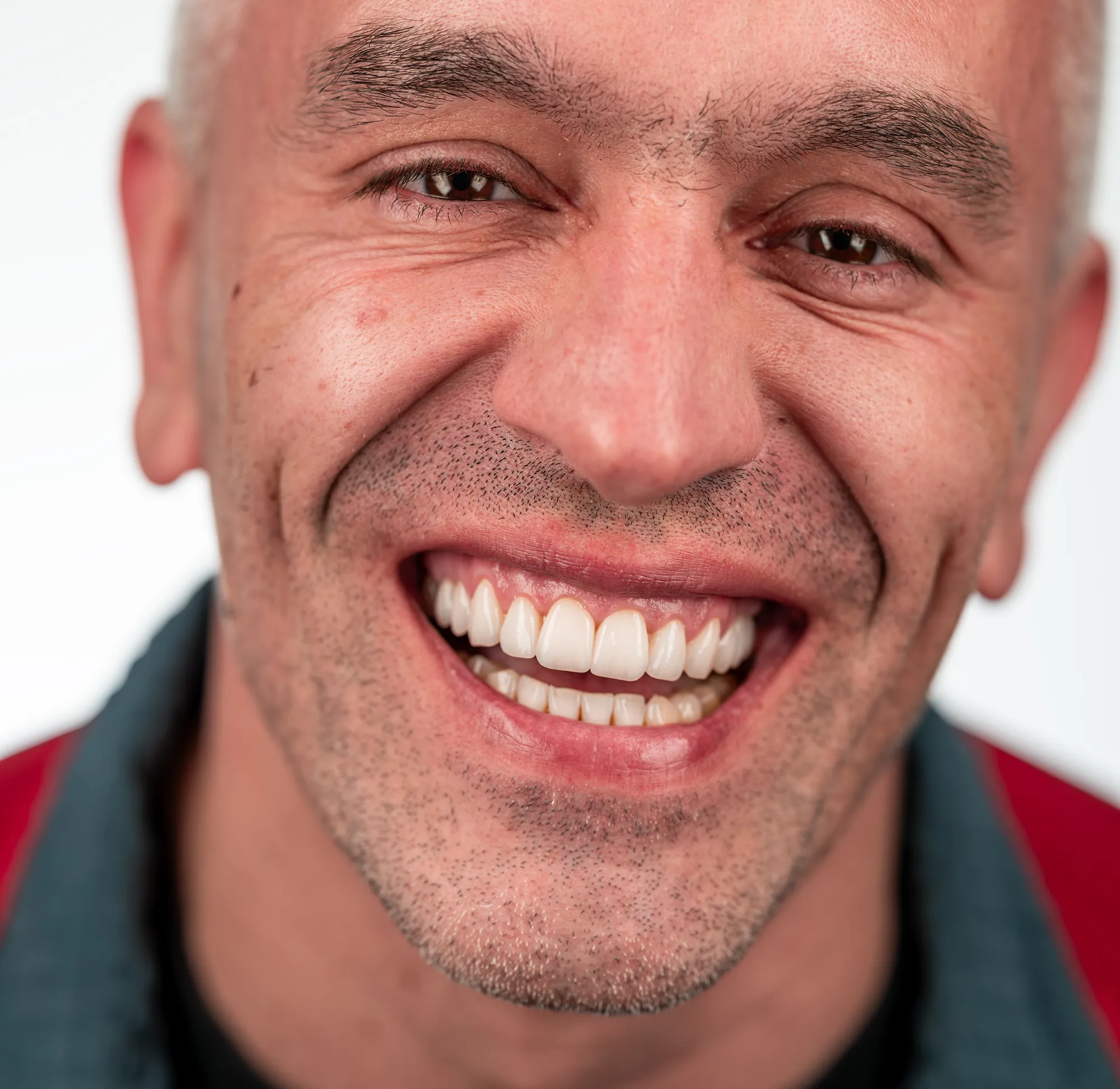 Smiling man, natural-looking teeth
