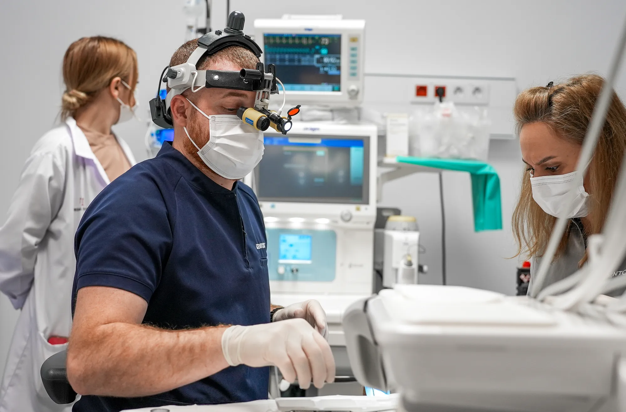Dentist with loupes treating in the dental suite at Medical Town